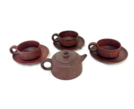 Oriental miniature teapot together with 3 cups and saucers, makers marks to base