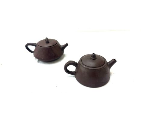 Two Chinese oriental tea pots , marks to base 