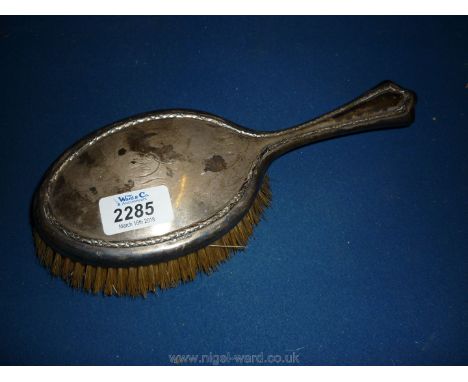 A Silver backed Hairbrush, engraved 'Mair', Sheffield, Walker &amp; Hall.