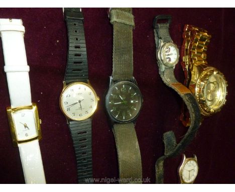 A quantity of watches including Invicta, Timex, etc.