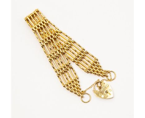 A 9ct gold&nbsp;six bar gate bracelet, width approx. 15mm, padlock clasp, safety chain, total weight approx. 25.6gms&nbsp;