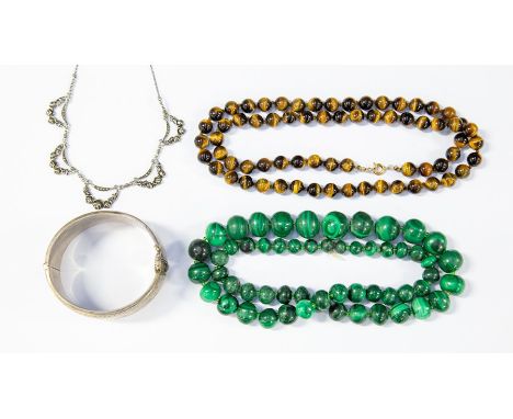 A small collection of costume jewellery, to include; A string of graduated malachite beads, a string of tigers eye beads, a s
