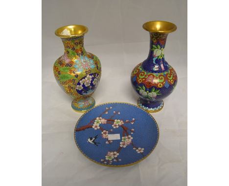 A collection of three Cloisonne enamel items to include: two vases, height approx. 21cm and a plate depicting Japanese cherry