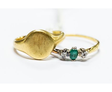 An 18ct signet ring, size J, approx 4.5gms; along with an 18ct gold, emerald and diamond dress ring, size P1/2, approx 1.6gms