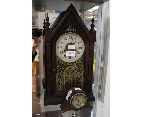A Continental made, mantle clock, in the ecclesiastical style, bearing Roman numerals; together with a small travel clock, be