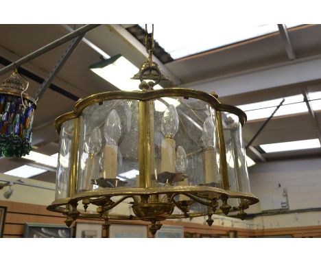 Brass and glass mid 20th Century eight branch ceiling light with glass shade