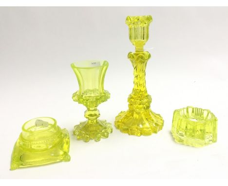 Four items of uranium glass including barley twist candlestick, salt etc