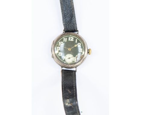 Rolex wristwatch. Black enamel dial with Arabic numerals with seconds dial. Chip to dial with number 4 now missing. Inside of