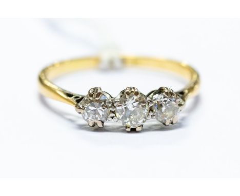 An 18ct yellow gold and diamond three stone ring, size M, total gross weight approx 1.9gms