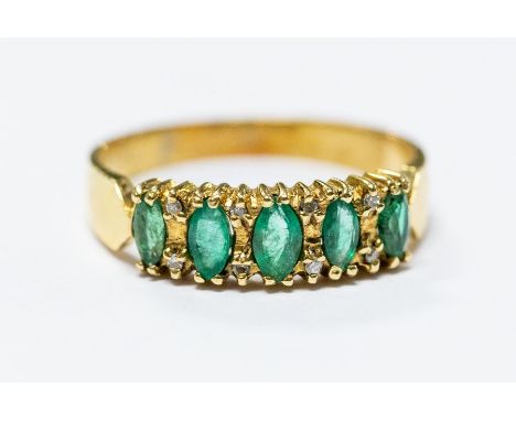 A yellow gold and emerald five-stone ring, diamond accents, size M, total gross weight approx 2.9gms