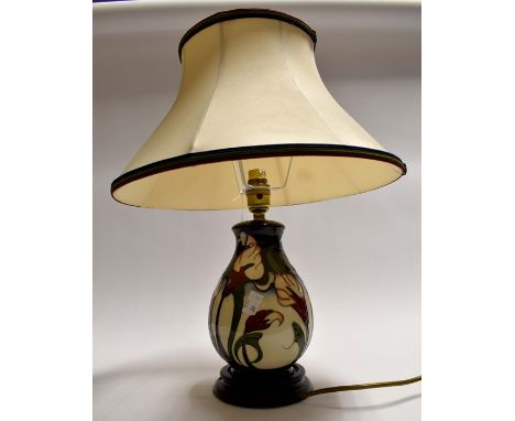 A 20th Century Moorcroft table lamp, with shade,&nbsp;height to top of lamp, approx. 29cm, with shade, approx. 45cm.