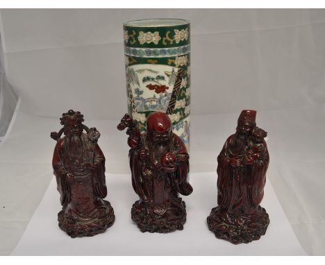 A collection of three resin Chinese gold figures; together with a ceramic Chinese brush pot. (4)
