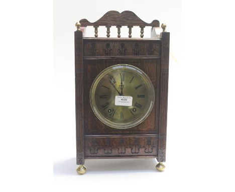 Hall &amp; Co. Manchester; An early Edwardian brass faced mantle clock, Roman numerals, galleried top, oak case, brass bun fe