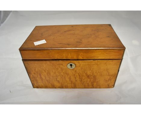 A late 19th century, maple veneer tea caddy with lidded inserts, having ivory knobs, does not shut properly, height approx. 1