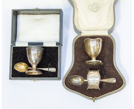 Two early 20th Century silver christening sets, comprising egg cup and spoon, Birmingham 1959, Turner &amp; Simpson, the othe