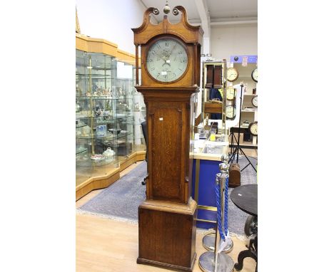 An early 19th Century oak longcase clock, 30 hour, 'Mofs, Nottingham', round dial, Arabic numerals, complete with pendulum, a