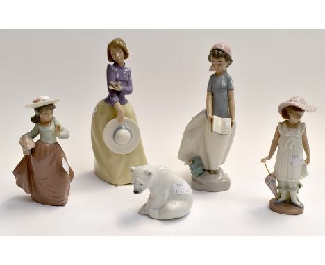 A Lladro polar bear together with four various Nao figurines. Lady with purple top has had head reattached, tiny chip to head