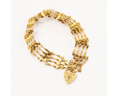 A 9ct gold four bar gate bracelet, width approx. 12mm, padlock clasp, weight approx.&nbsp; 8.7 grams, chain detached&nbsp;