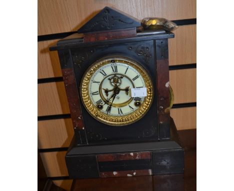 Ansonia, USA; A black and rouge slate and marble open faced mantle clock with Roman numerals, gilt surround face, height appr