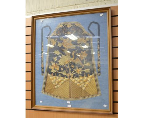 Two framed Chinese embroidered pictures, one containing a piece of oriental costume depicting a bird and flowers in gold and 