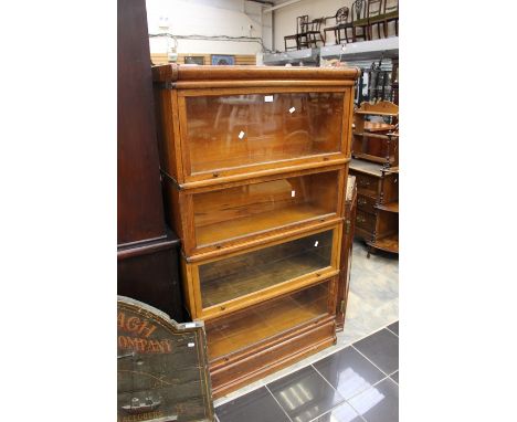 A Globe Wernick style oak four tier bookcase 156cm H x 87cm W x 31cm D