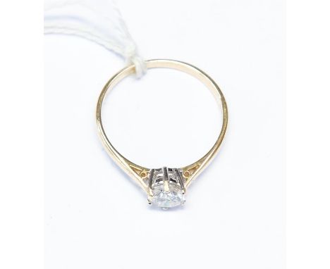 A 14k gold and moissanite solitaire ring, the stone weighing approx. 0.96ct mounted in a six claw setting, 14ct yellow gold m