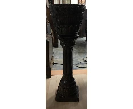 A brown lead glazed ceramic jardiniere on stand, height approx. 77cm.
