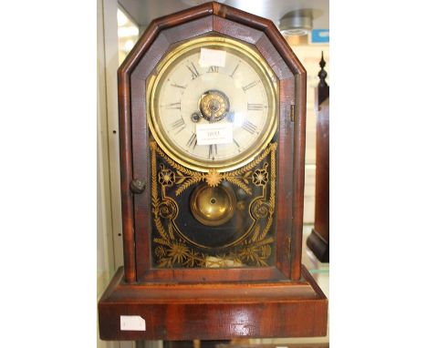 A late 19th century, mahogany cased mantle clock, painted dial, glass door with painted decoration, height approx. 36cm.