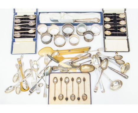 A collection of silver flatware, boxed and unboxed including napkin ring and ivory handled silver