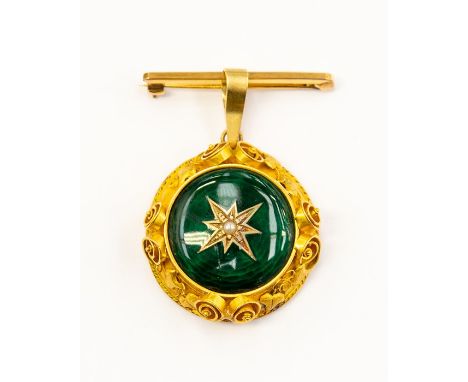 A Victorian enamel locket pendant, comprising a circular domed form of green enamel, star set to the centre with a small seed