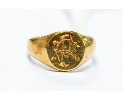 An 18ct gold signet ring, monogrammed R.P, size E, total weight approx. 3.2gms