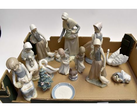 A collection of boxed and unboxed Lladro figures and Nao figures to include seated and standing examples. (one box)