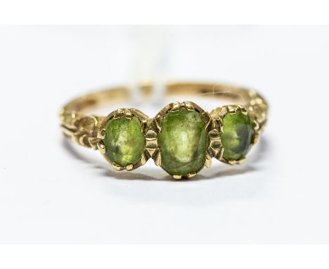 An early 20th Century peridot three stone ladies dress ring, size R, 2.9 grams approx