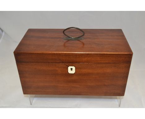 A mahogany tea caddy, internally complete, with white metal carry handle, height approx. 17cm.