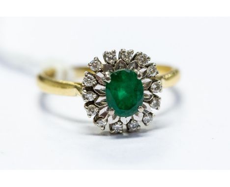 An 18ct gold emerald and diamond cluster ring, size N1/2, total gross weight approx 3.3gms