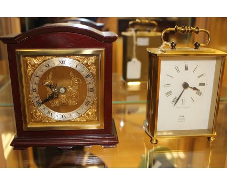 A Cope Jewellers, Quartz, battery operated carriage clock; together with an Elliott, London, mantle clock, both bearing Roman