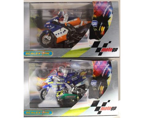 Scalextric Moto GP motorcycles including Neil Hodgson on Ducati and Colin Edwards on Ducati both are boxed, slight damage to 