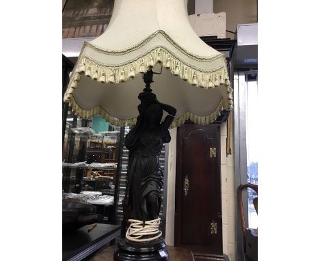 Two table lamps; one depicting lady water carrier, bronzed effect, Height approx 60 cms; and a brass cherub lamp on ornate ba