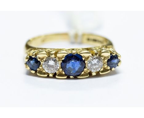 A Victorian style 18ct gold, sapphire and diamond dress ring, size M1/2, total gross weight approx 6.2gms, London 1977