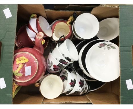 A Royal Minton part Petunia coffee service and Royal Albert Black Roses six piece tea service.