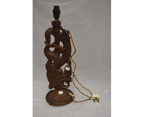 An Asian wooden lamp base, possibly Japanese, untested, carving of a dragon, height approx. 53cm.