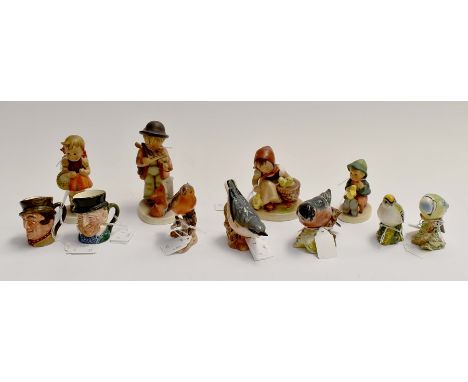 A collection of assorted Beswick bird figures including: Bull Finch, 1042; Nuthatch, 2413; Gold Crest, 2415; and two others; 