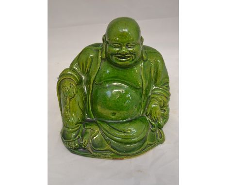A green glazed, ceramic Buddha, indistinct mark to base, height approx. 20cm.