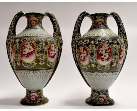A pair of circa 1920's Japanese Satsuma twin handled vases, enamel decoration, height approx. 39cm. (2)