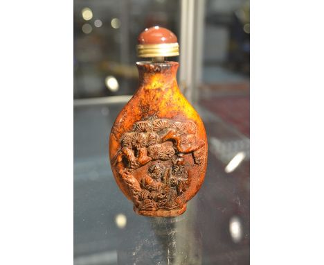 A 19cth Century carved antler scent/ snuff bottle, no makers mark, smooth stone top,&nbsp; carved Chinese men playing a game 