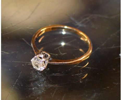 DIAMOND SOLITAIRE RING ON UNMARKED GOLD BAND, APPROXIMATELY .25 CARATS    