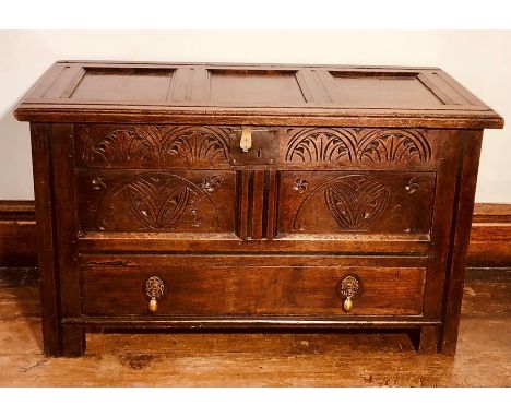 A Charles II oak mule chest, circa 1670, three moulded panel lid, metal lock, two moulded panel&nbsp;front with decorative ca