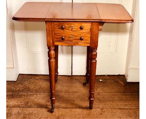 A mid Victorian mahogany work table, circa 1860, drop leaves, two short drawers to one side, drawer fascias to the other, tur