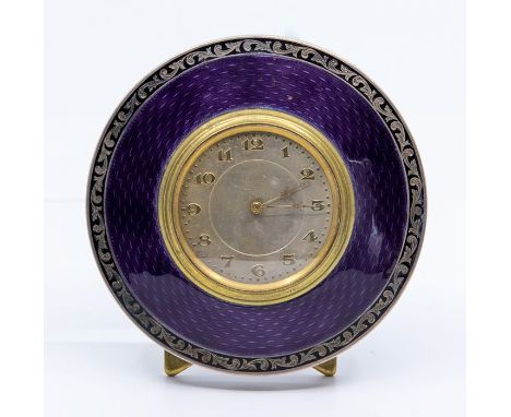 A George V silver circular easel desk or bedside timepiece, purple guilloche enamel frame in a black scroll border, Birmingha
