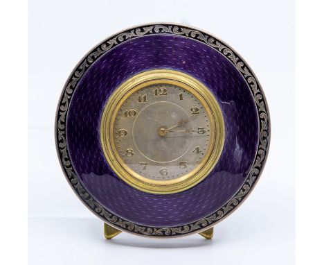 A George V silver circular easel desk or bedside timepiece, purple guilloche enamel frame in a black scroll border, Birmingha